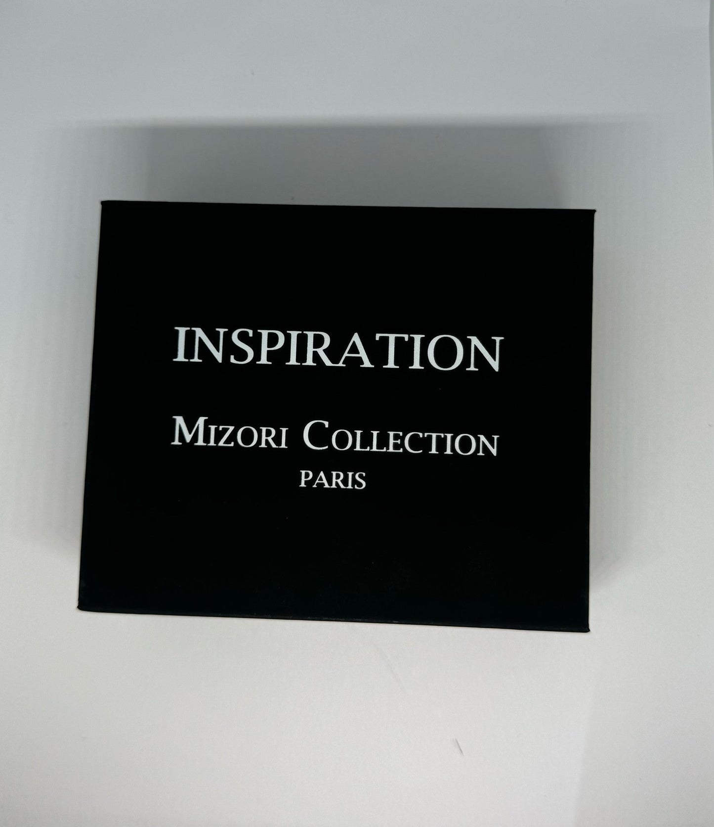 Mizori Collection Paris Inspiration car perfume with hanging cord, luxury automotive fragrance providing a fresh, long-lasting scent
