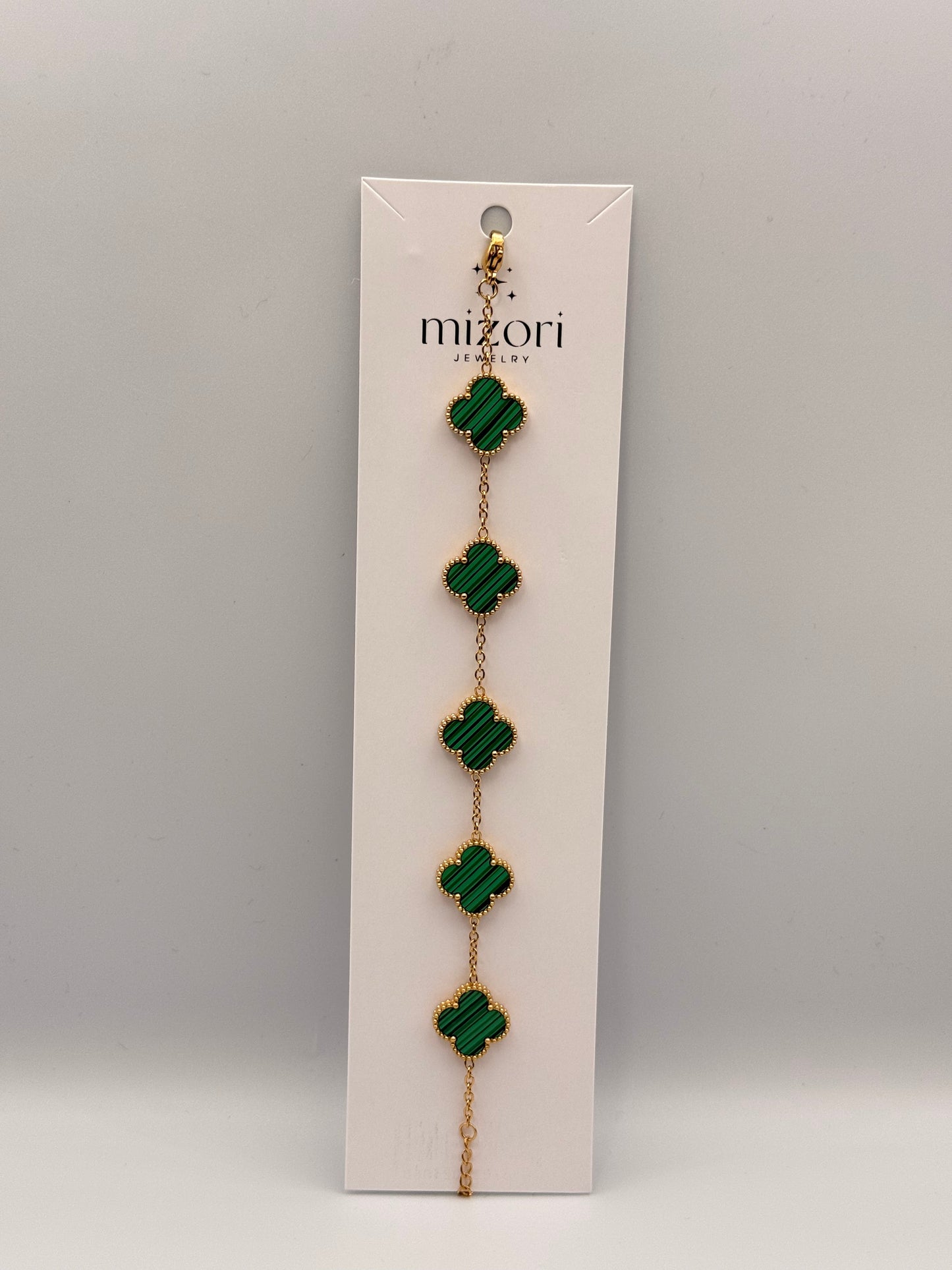 Mizori Jewelry green stainless steel clover bracelet, elegant and minimalist women’s fashion accessory.