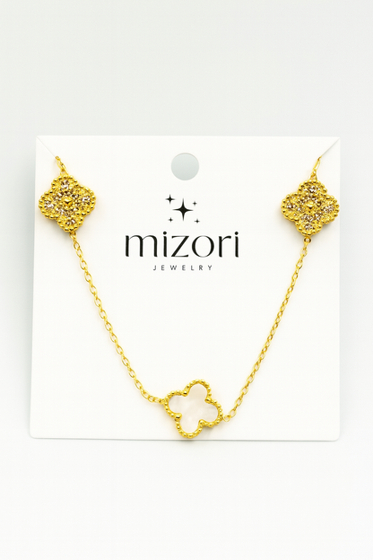 Mizori Jewelry stainless steel gold necklace with two crystal clovers and one 13mm white clover, water resistant and tarnish resistant.
