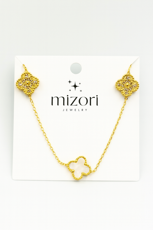 Mizori Jewelry stainless steel gold necklace with two crystal clovers and one 13mm white clover, water resistant and tarnish resistant.