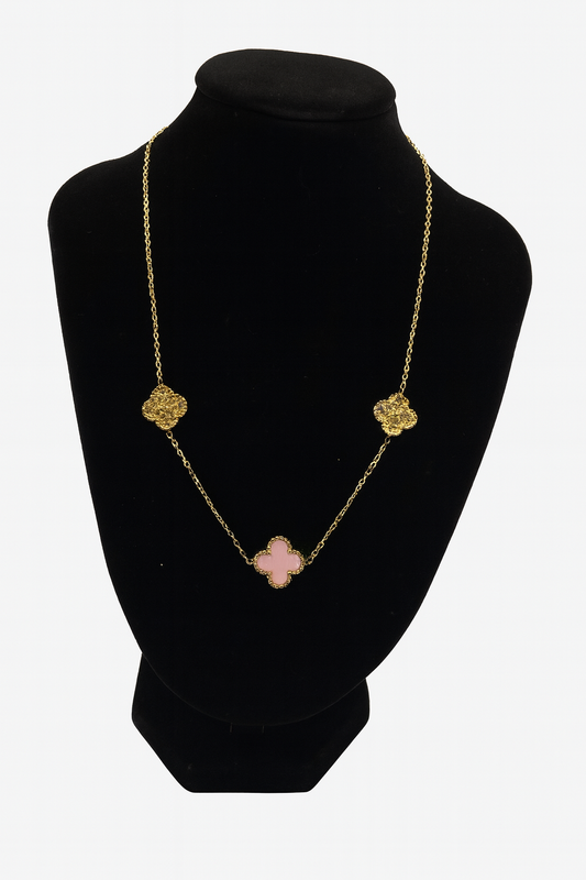 Mizori Jewelry stainless steel 13mm pink clover necklace with crystals in gold finish displayed on stand – water resistant and elegant design