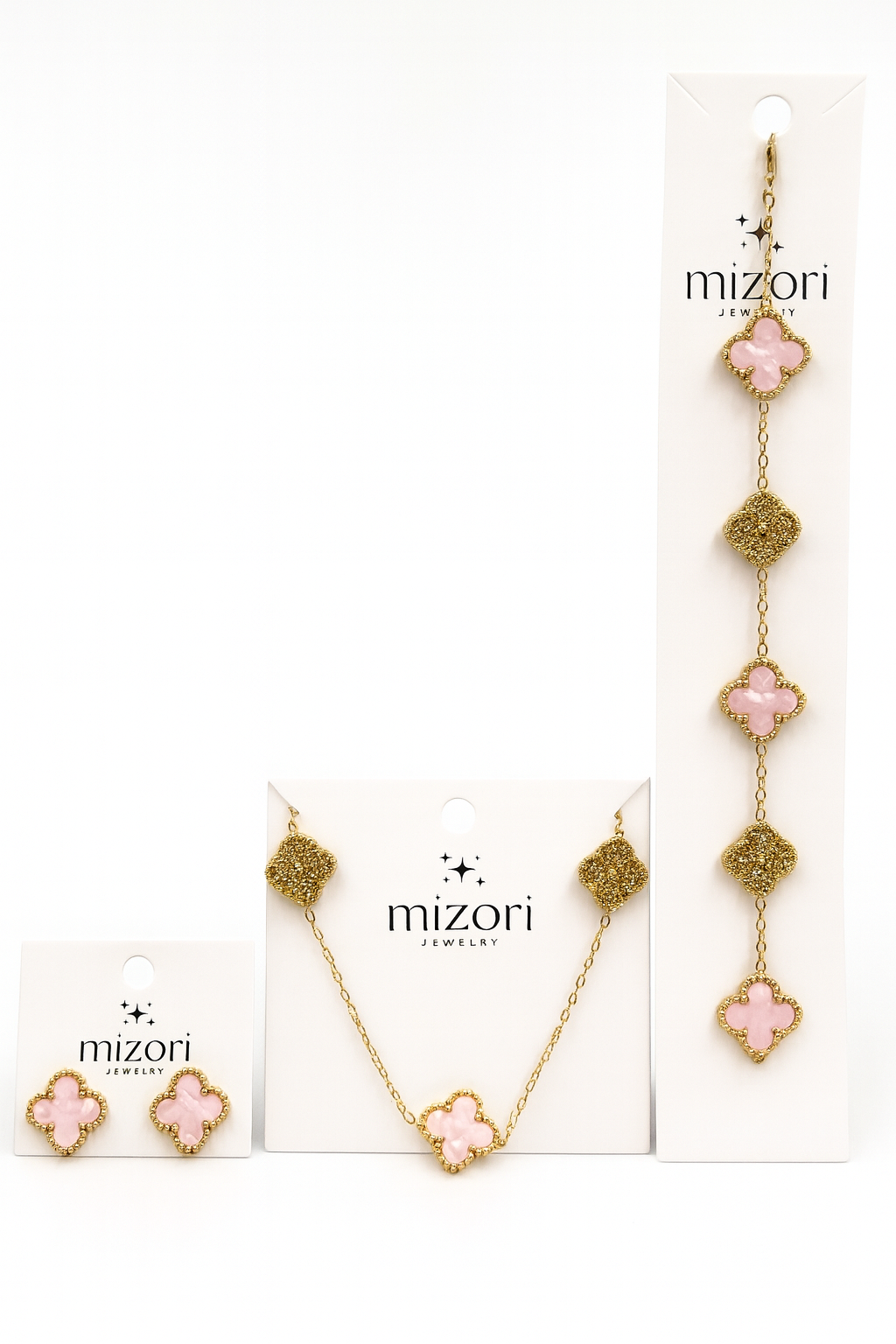 Mizori Jewelry stainless steel gold set with pink clover necklace, bracelet, and 15mm earrings, water resistant and tarnish resistant.