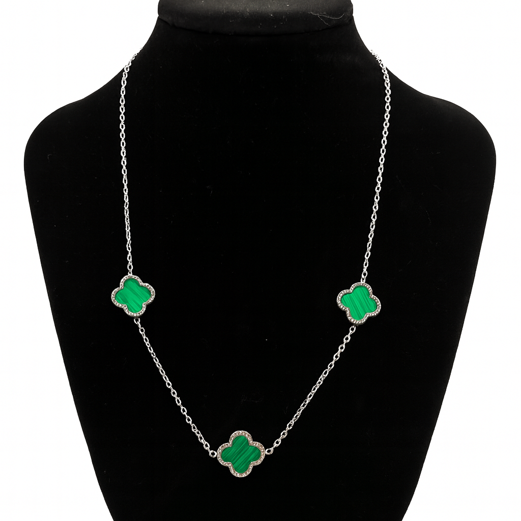 Mizori Jewelry stainless steel silver necklace with three 13mm green clovers displayed on stand