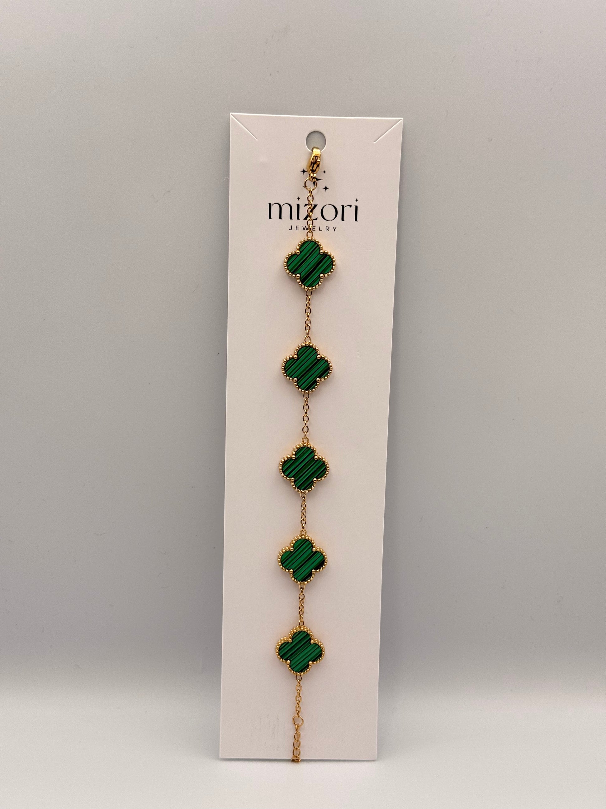 Mizori Jewelry green stainless steel clover bracelet, elegant and minimalist women’s fashion accessory.