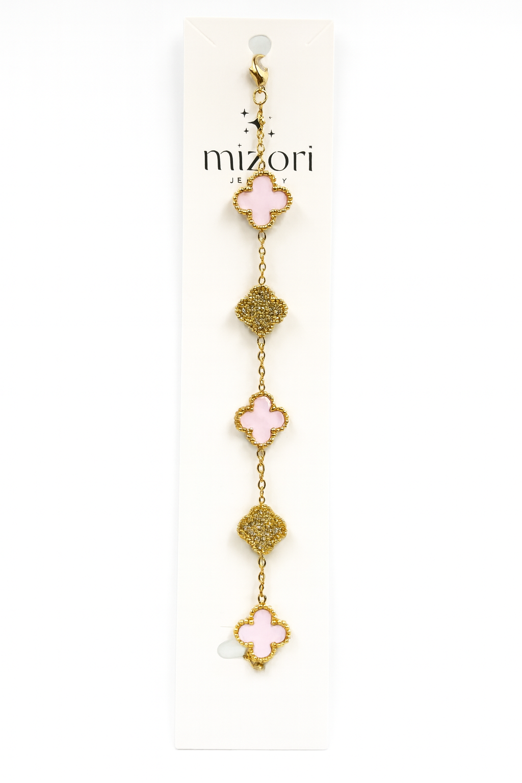 Mizori Jewelry stainless steel gold bracelet with three 13mm pink clovers and two crystal clovers, water resistant and tarnish resistant.