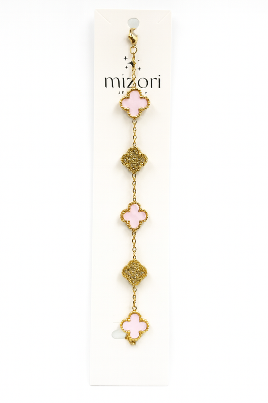 Mizori Jewelry stainless steel gold bracelet with three 13mm pink clovers and two crystal clovers, water resistant and tarnish resistant.
