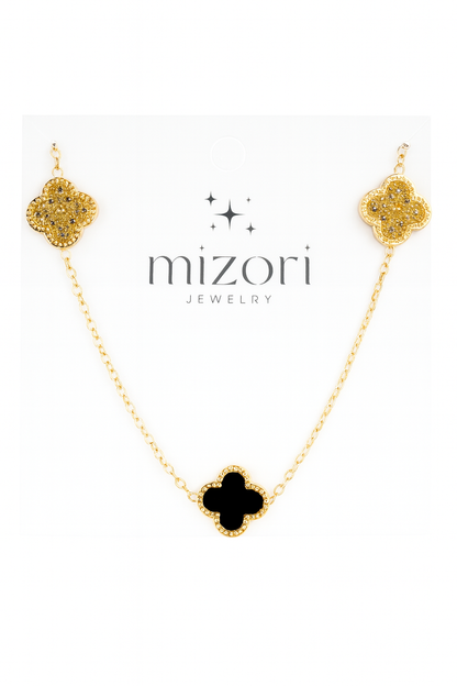 Mizori Jewelry stainless steel gold necklace with two crystal clovers and one 13mm black clover pendant, water-resistant and tarnish-free.