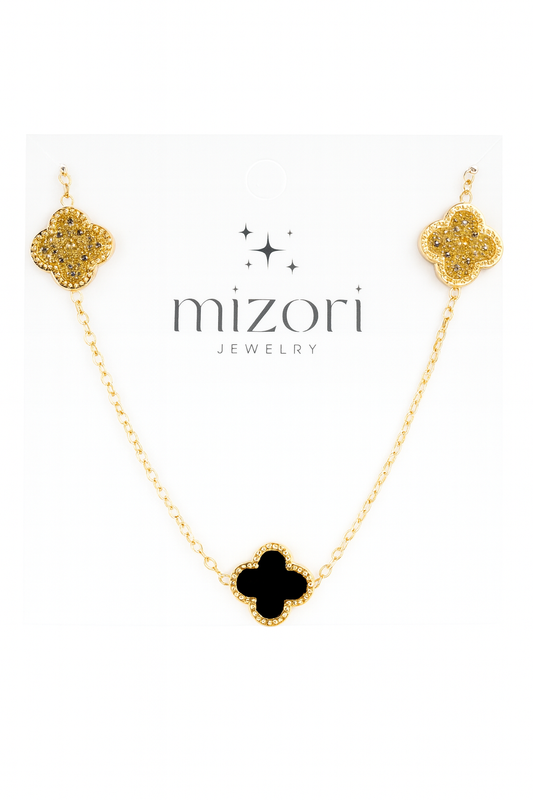 Mizori Jewelry stainless steel gold necklace with two crystal clovers and one 13mm black clover pendant, water-resistant and tarnish-free.