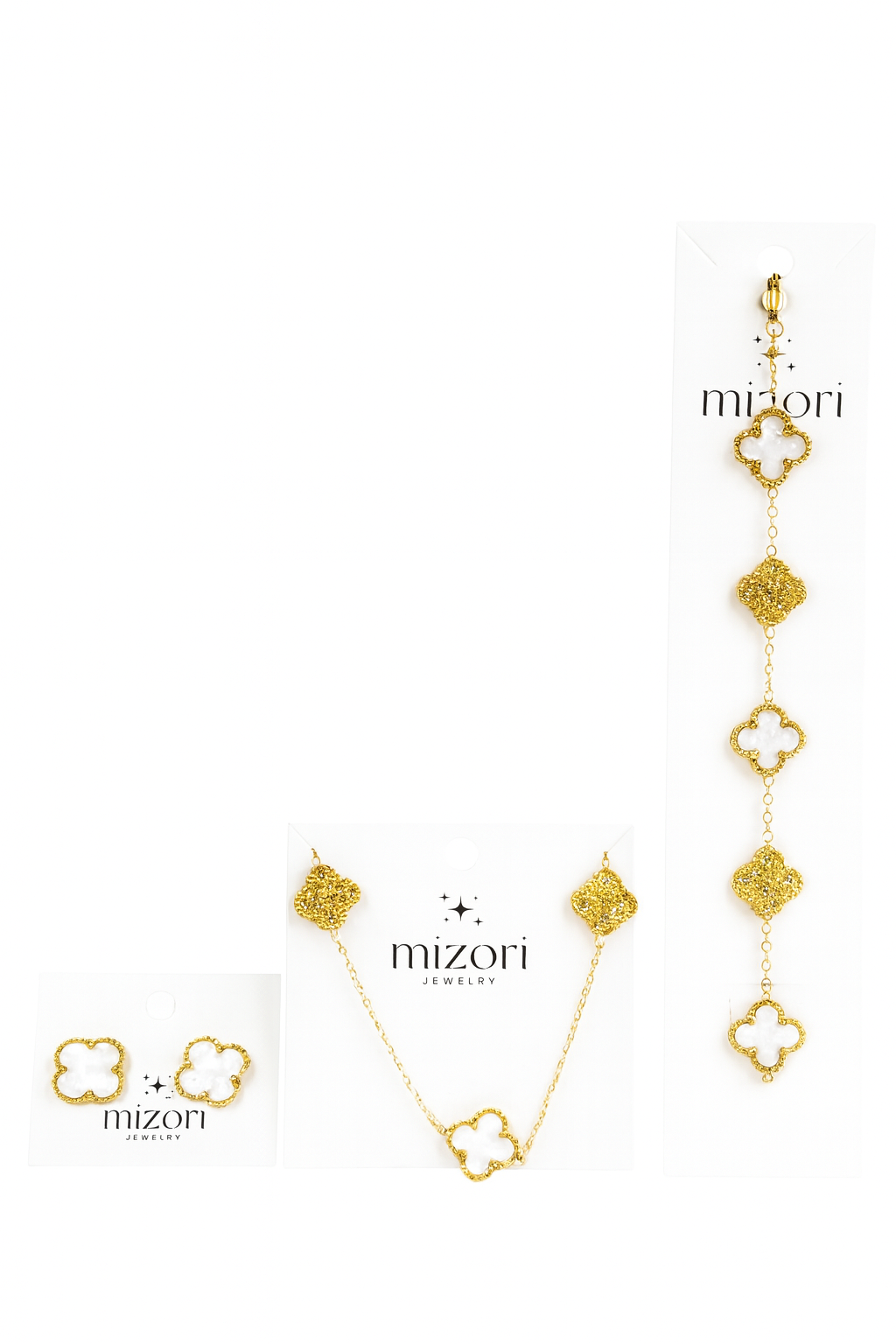 Mizori Jewelry stainless steel gold set with 13mm white clover necklace, bracelet, and earrings accented with crystal clovers, water resistant.