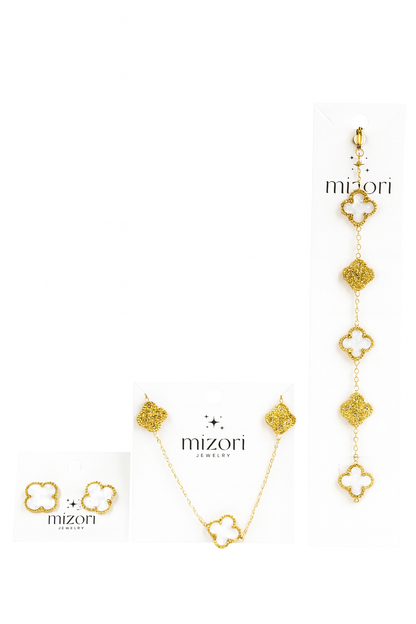 Mizori Jewelry stainless steel gold set with 13mm white clover necklace, bracelet, and earrings accented with crystal clovers, water resistant.