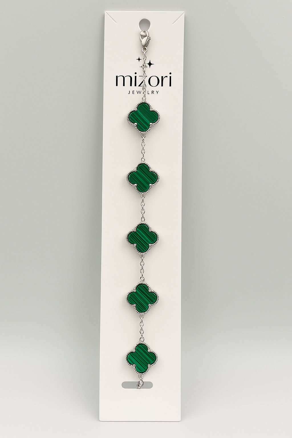 Mizori Jewelry stainless steel silver bracelet with five 13mm green clovers, water resistant and tarnish resistant.