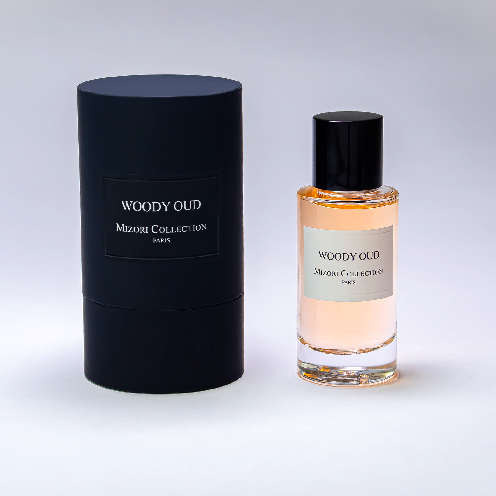 Mizori Collection Paris Woody Oud 50ML Eau De Parfum with Packaging – Luxurious unisex scent featuring oud, rose, jasmine, amber, and musk in an elegant presentation.